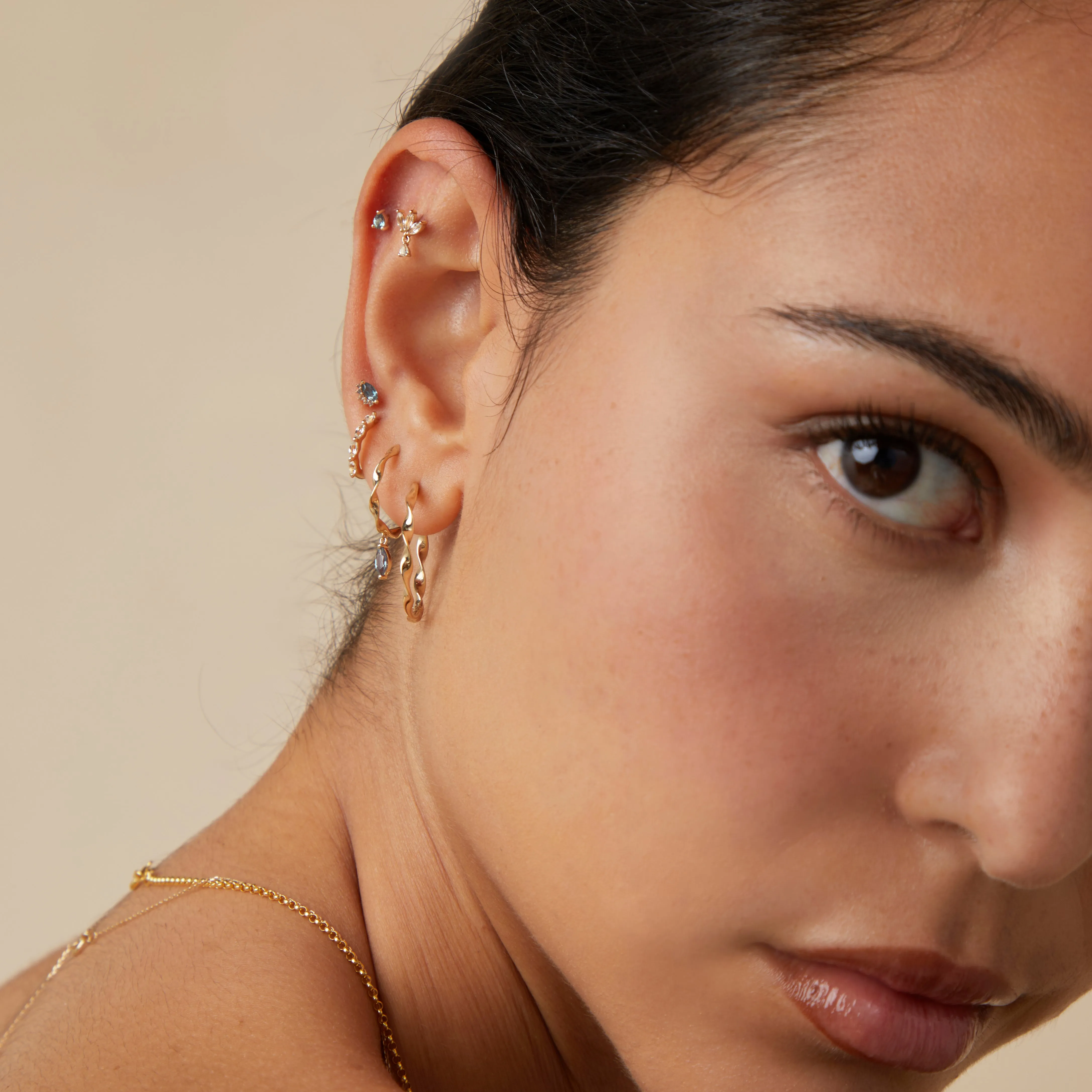 White Topaz Marquise Huggies in Solid Gold